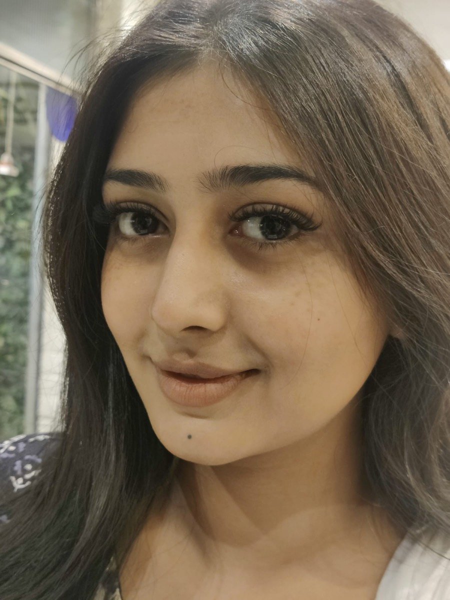 Client smiling with American volume eyelash extensions